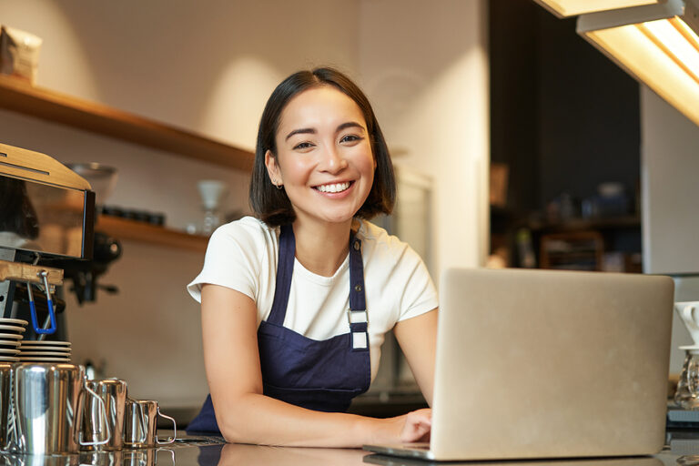 bigstock Enthusiastic Asian Girl In Caf 467341295