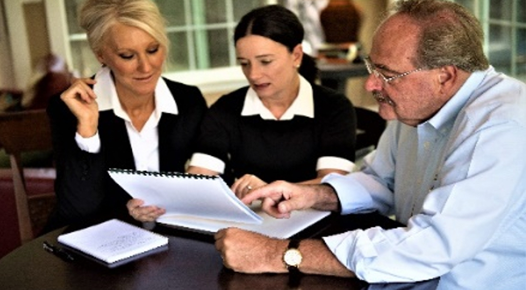 Image of Glen speaking with clients