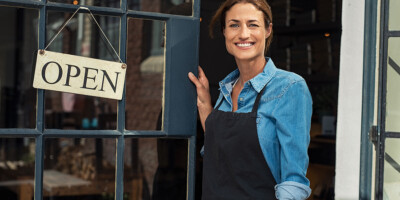 bigstock Portrait of a happy waitress s 270854422