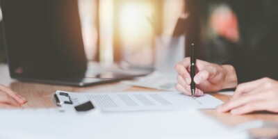 bigstock Businessman Checking Contract 477819395
